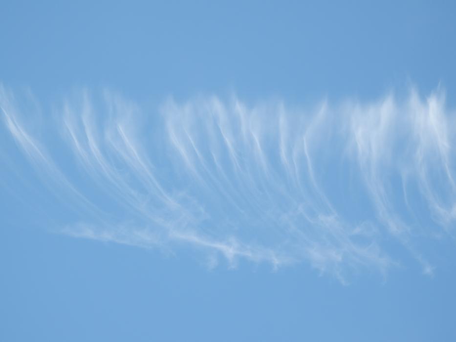 traces of clouds in the blue sky