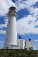 white beacon by the house