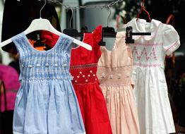 Children beautiful dresses on a hanger