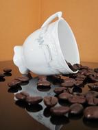 coffee beans near white cup