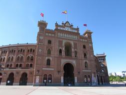 beautiful museum building with flags