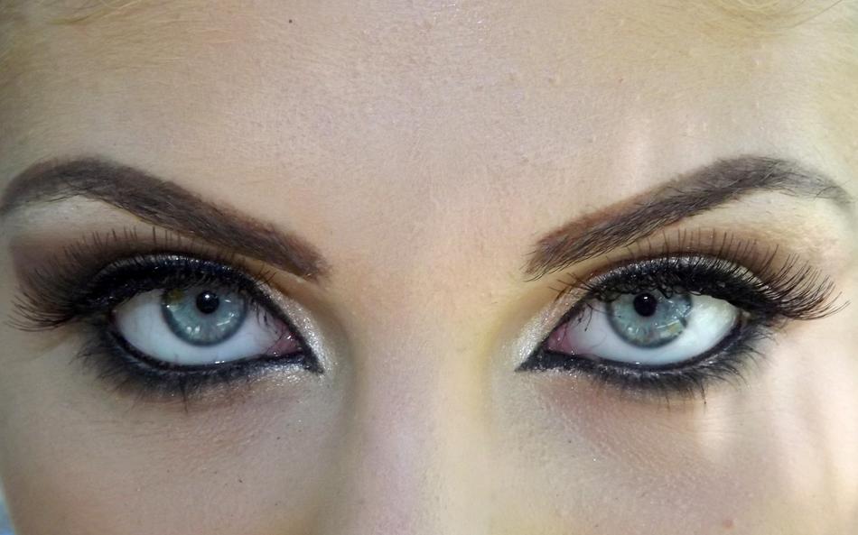 woman painted eyes are shiny