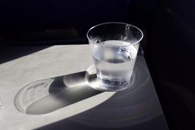 plastic cup of water on the table