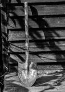 shovel near an old house