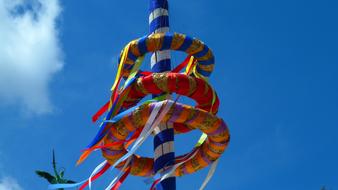 colorful may pole with ribbons
