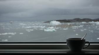 A cup of coffee on the windowsill