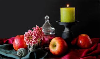 Beautiful and colorful still life with fruits, flowers, candle and decorations