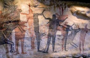 Old drawings of people on the wall