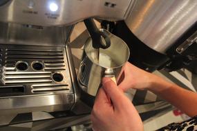 barista makes coffee