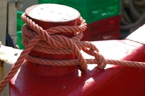Tied rope on red iron