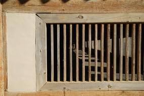 wooden bars in the window on the house