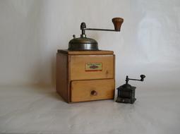 wooden grinder by the wall