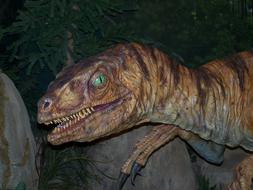 velociraptor figure in an amusement park