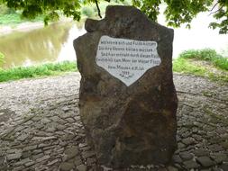 stone monument with signature