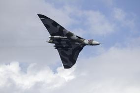 show of a flying military aircraft in the sky