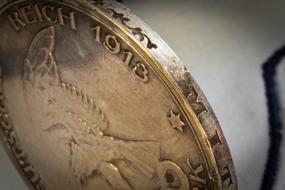silver coin with eagle
