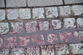 splashes of red paint on the road