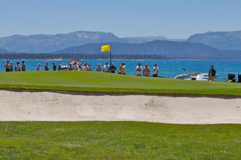golf course by the lake with people