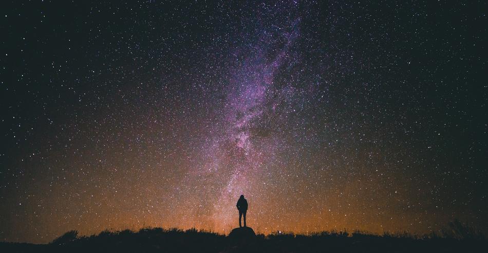 human silhouette against a starry sky