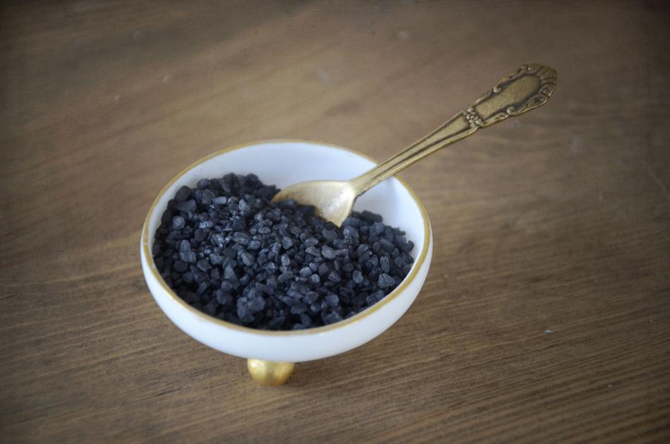 black crystalline salt in a plate