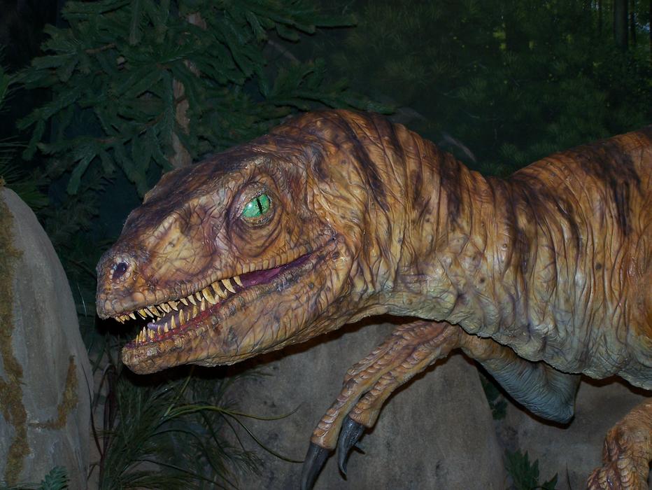 velociraptor figure in an amusement park
