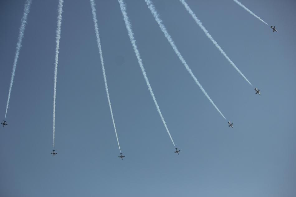 white trail of planes in the sky