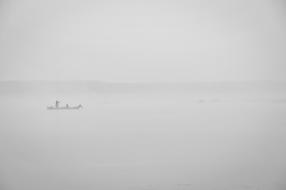 floating boat in the fog