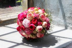 round pink Bouquet on windowsill