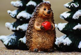 figurine of a hedgehog with an apple