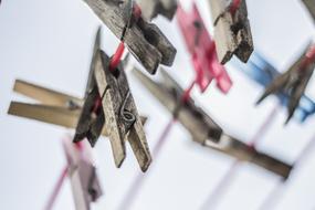 wooden pegs on a string