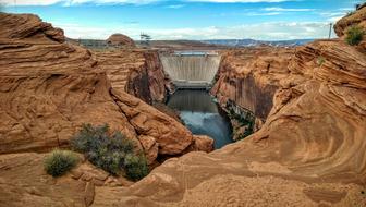 dam near the lake in the rocks