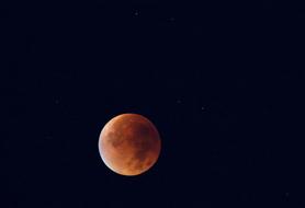 darkening of the moon in the sky