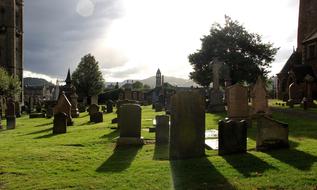 emetery with graves in the grass