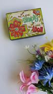 Colorful, retro box near the colorful and beautiful bouquet of flowers
