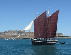 floating boat with big sails