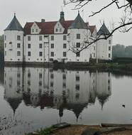 beautiful white castle by the lake