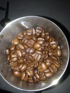 Coffee beans in an iron jar