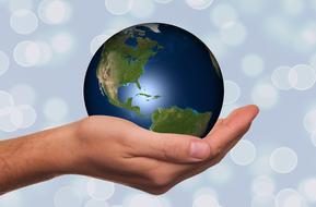 the planet in the hand of human