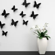 black butterflies on a white wall