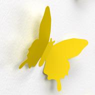 yellow paper butterfly on the wall