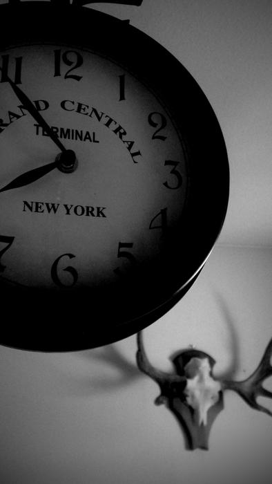 black and white clock indicating the time