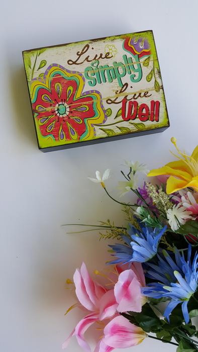 Colorful, retro box near the colorful and beautiful bouquet of flowers