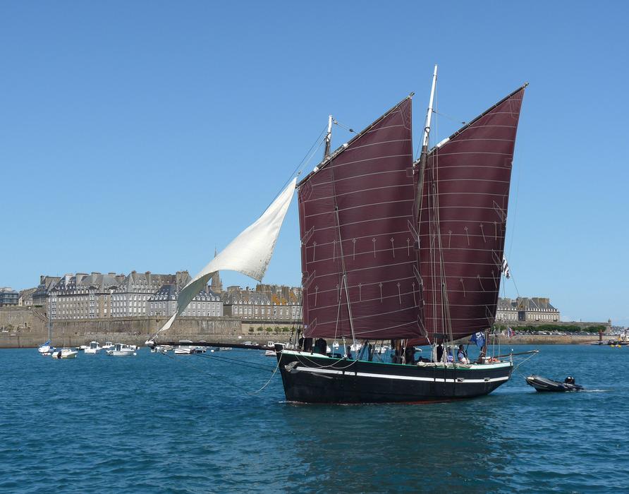 floating boat with big sails