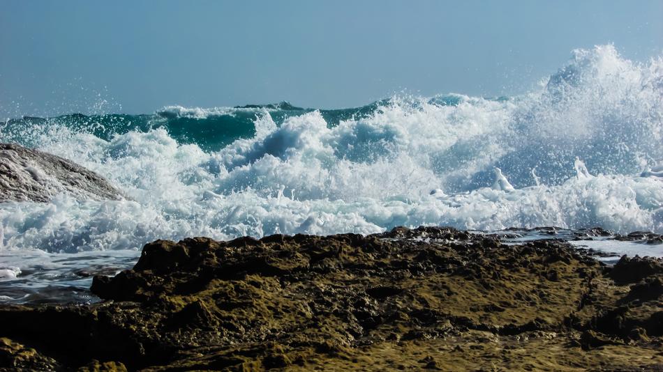 big waves crashing against the rocks