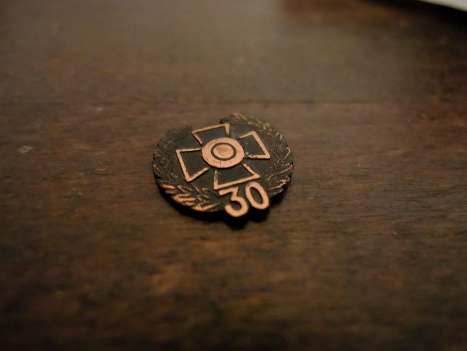 old bronze medal on the table