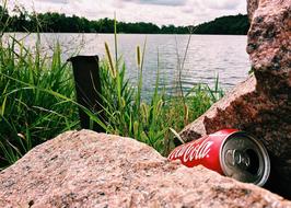 discarded can near the river