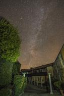 beautiful starry sky above the houses in the village