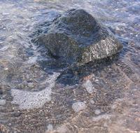 big stone in the water