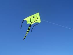 paper green kite in the sky