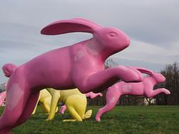 running colored hares sculpture